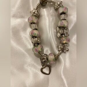 Pandora-Style Bracelet with Pink, White beads and Silver Beads.